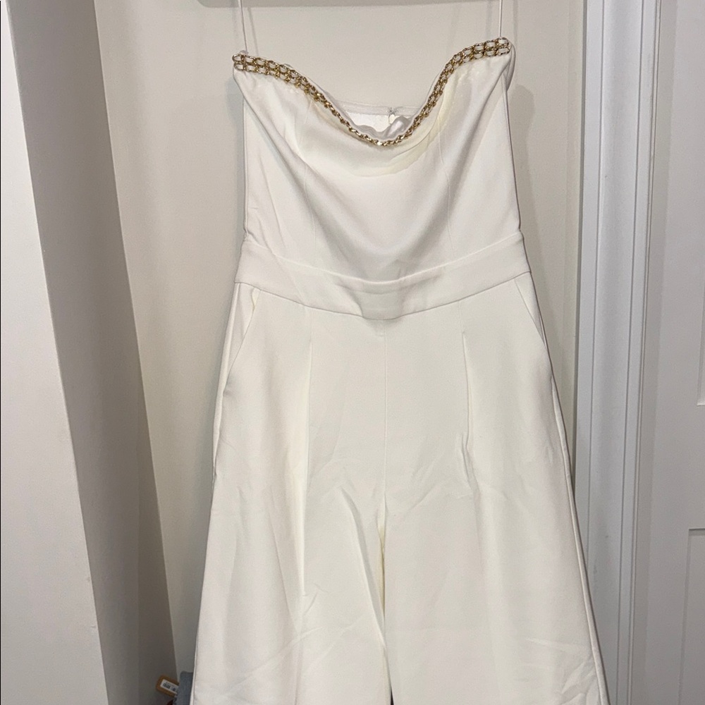 Generational Love White Bootcut Strapless Jumpsuit with Gold Chain Detail